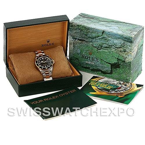 The image shows a Rolex Submariner 16613T Men's Steel and Gold (two tone) Black Dial 16613T Men's Steel and Gold (two tone) Black Dial watch in its box, along with the outer box and user manuals displayed alongside it.