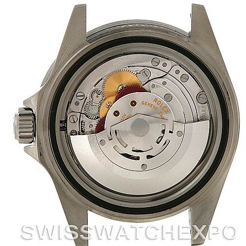 The image shows a rear view of the Rolex Submariner 16610T Men
s Stainless Steel Black Dial 16610T Men
s Stainless Steel Black Dial watch, displaying its internal automatic movement mechanism.