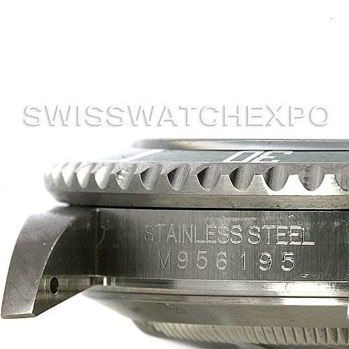 The image shows the side view of a Rolex Submariner 16610T Men
s Stainless Steel Black Dial 16610T Men
s Stainless Steel Black Dial, highlighting the stainless steel case and serial number.