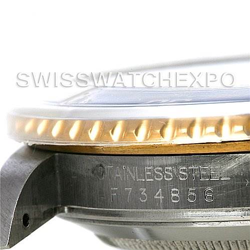 This image shows a close-up side view of the bezel and a portion of the case with serial number of a Rolex Submariner 16613 Men's Steel and Gold (two tone) Grey Dial 16613 Men's Steel and Gold (two tone) Grey Dial watch.