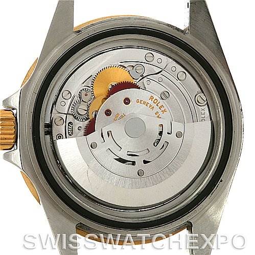 The image shows the backside of the Rolex Submariner 16613 Men's Steel and Gold (two tone) Grey Dial 16613 Men's Steel and Gold (two tone) Grey Dial, highlighting its internal mechanical movement components.