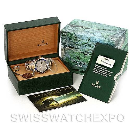 The image shows a Rolex Submariner 16613 Men's Steel and Gold (two tone) Grey Dial 16613 Men's Steel and Gold (two tone) Grey Dial watch, its open case, booklet, and the outer box, all from a front angle.