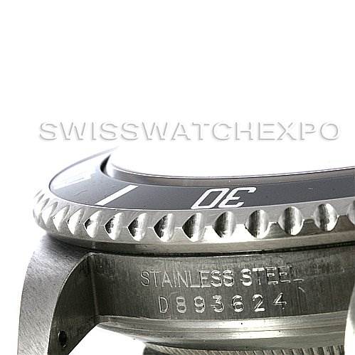 This image shows a close-up of the bezel, case, and serial number of a Rolex Submariner 16610T Men's Stainless Steel Black Dial 16610T Men's Stainless Steel Black Dial watch.