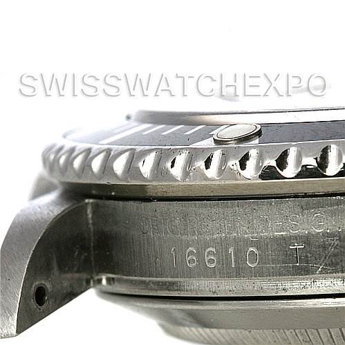 The image shows a close-up of the side of a Rolex Submariner 16610 Men's Stainless Steel Black Dial 16610 Men's Stainless Steel Black Dial watch, highlighting the bezel, case, and reference number 16610 T.