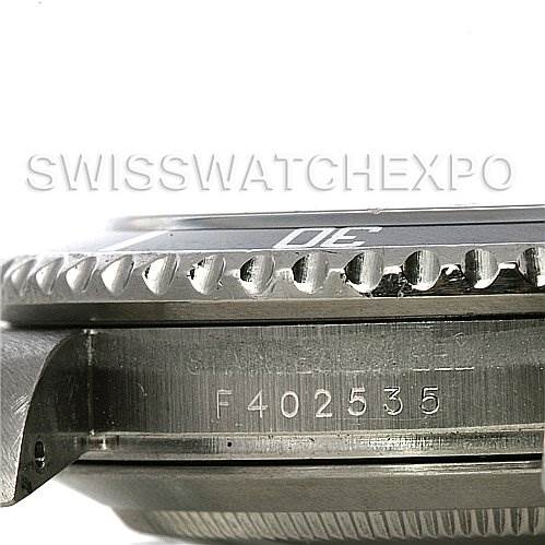 The image shows a side-angle view of the Rolex Submariner 16610 Men's Stainless Steel Black Dial 16610 Men's Stainless Steel Black Dial, highlighting the bezel and part of the case with a visible serial number.