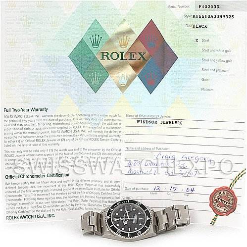 The image shows a Rolex Submariner 16610 Men's Stainless Steel Black Dial 16610 Men's Stainless Steel Black Dial watch lying flat, with its face, bezel, and bracelet clearly visible, alongside warranty papers and certification.