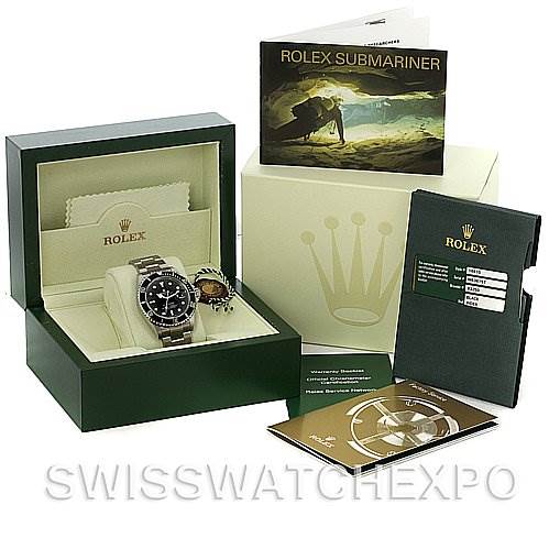 The image shows a Rolex Submariner 16610 Men's Stainless Steel Black Dial 16610 Men's Stainless Steel Black Dial watch in its box, along with accompanying booklets and certificates, angled from the front.
