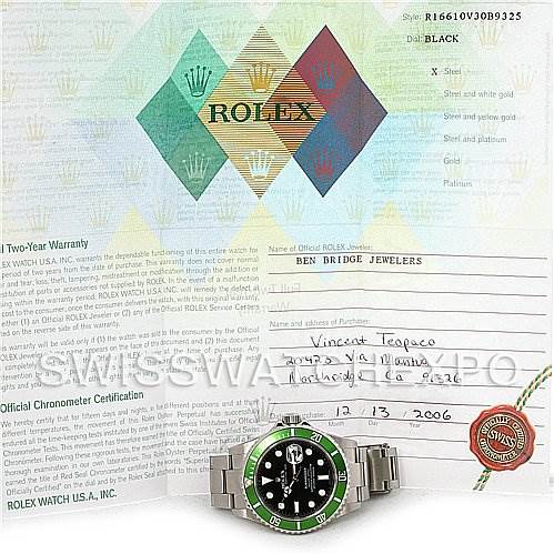 The image shows a Rolex Submariner 16610LV Men's Stainless Steel Black Dial 16610LV Men's Stainless Steel Black Dial watch with a green bezel, accompanied by warranty papers and certification documents.