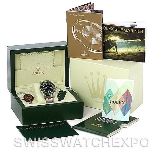 This image shows a Rolex Submariner 16610LV Men's Stainless Steel Black Dial 16610LV Men's Stainless Steel Black Dial watch in its green box, including various booklets and tags.