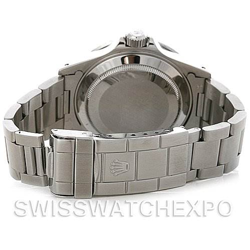 The back view of a Rolex Submariner 16610 Men's Stainless Steel Black Dial 16610 Men's Stainless Steel Black Dial watch showing the clasp, bracelet, and case back.