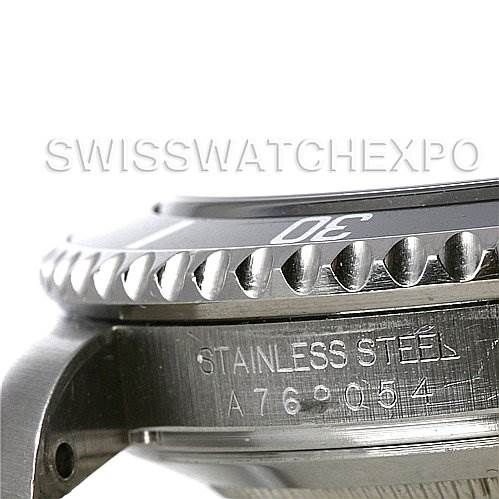 This image shows a close-up side view of a Rolex Submariner 16610 Men's Stainless Steel Black Dial 16610 Men's Stainless Steel Black Dial watch, focusing on the bezel and the engraved stainless steel casing.