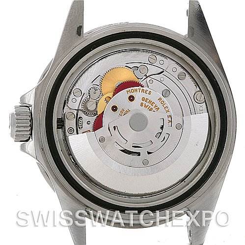 This image shows the back view of a Rolex Submariner 16610 Men's Stainless Steel Black Dial 16610 Men's Stainless Steel Black Dial watch with the movement and internal components exposed.