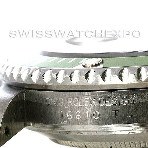 The image shows a close-up side view of the bezel and case of a Rolex Submariner 16610LV Men
s Stainless Steel Black Dial 16610LV Men
s Stainless Steel Black Dial model 16610 watch, highlighting the engraved text.