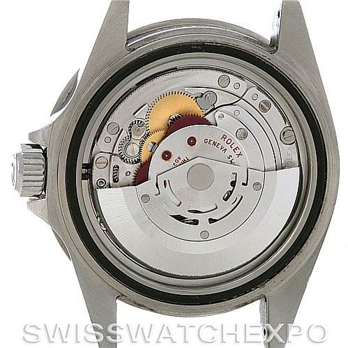 This image shows the open case back of a Rolex Submariner 16610 Men's Stainless Steel Black Dial 16610 Men's Stainless Steel Black Dial, revealing its internal mechanical movement parts.