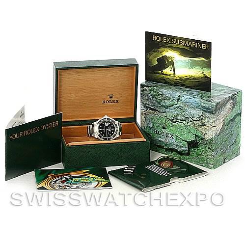 The image shows a Rolex Submariner 16610 Men's Stainless Steel Black Dial 16610 Men's Stainless Steel Black Dial watch in its box, along with accompanying booklets and packaging.