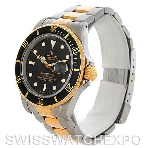 This image shows a Rolex Submariner 16613 Men's Steel and Gold (two tone) Black Dial 16613 Men's Steel and Gold (two tone) Black Dial watch at a slight angle, highlighting the bezel, dial, crown, and two-tone bracelet.