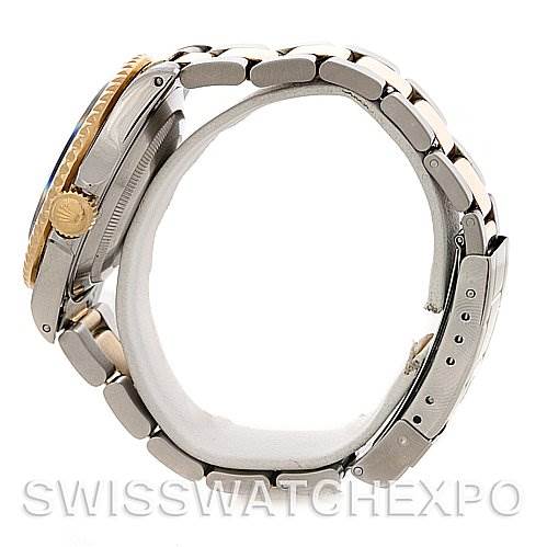 Side view of a Rolex Submariner 16613 Men's Steel and Gold (two tone) Black Dial 16613 Men's Steel and Gold (two tone) Black Dial watch showing the band, crown, and side of the case.