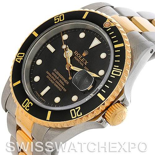This image shows a Rolex Submariner 16613 Men's Steel and Gold (two tone) Black Dial 16613 Men's Steel and Gold (two tone) Black Dial watch at a slight angle, highlighting the bezel, dial, and part of the bracelet.