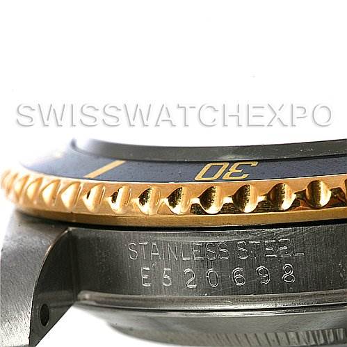 The image shows a close-up side view of a Rolex Submariner 16613 Men's Steel and Gold (two tone) Black Dial 16613 Men's Steel and Gold (two tone) Black Dial, highlighting the bezel and part of the case with its serial number visible.