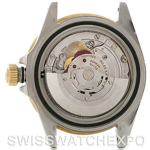 The image shows the back view of a Rolex Submariner 16613 Men's Steel and Gold (two tone) Black Dial 16613 Men's Steel and Gold (two tone) Black Dial watch, revealing its internal movement and mechanical components.