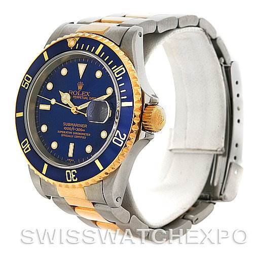 This image shows a Rolex Submariner 16613 Men's Steel and Gold (two tone) Blue Dial 16613 Men's Steel and Gold (two tone) Blue Dial watch from an oblique angle, highlighting the dial, bezel, crown, and bracelet.