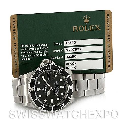 The image shows a Rolex Submariner 16610 Men's Stainless Steel Black Dial 16610 Men's Stainless Steel Black Dial watch positioned at an angle, with the dial, bezel, and part of the bracelet visible, alongside its warranty card.
