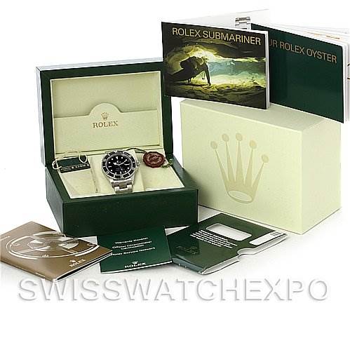 The image shows a Rolex Submariner 16610 Men's Stainless Steel Black Dial 16610 Men's Stainless Steel Black Dial watch in its box, accompanied by booklets and packaging materials, viewed from a straight-on angle.