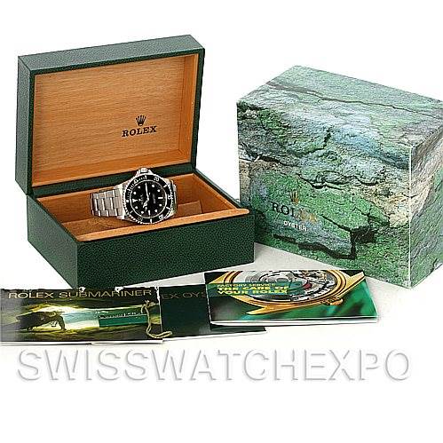 The image features a Rolex Submariner 14060M Men's Stainless Steel Black Dial 14060M Men's Stainless Steel Black Dial watch in an open box, along with its outer box, manuals, and accessories.