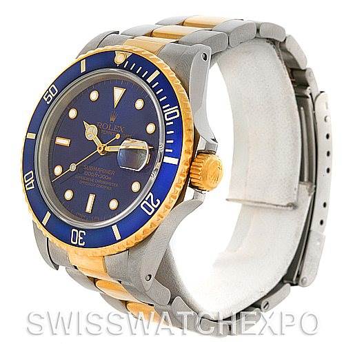The image shows a Rolex Submariner 16803 Men's Steel and Gold (two tone) Blue Dial 16803 Men's Steel and Gold (two tone) Blue Dial watch at a three-quarter angle, revealing the dial, bezel, crown, and part of the bracelet.