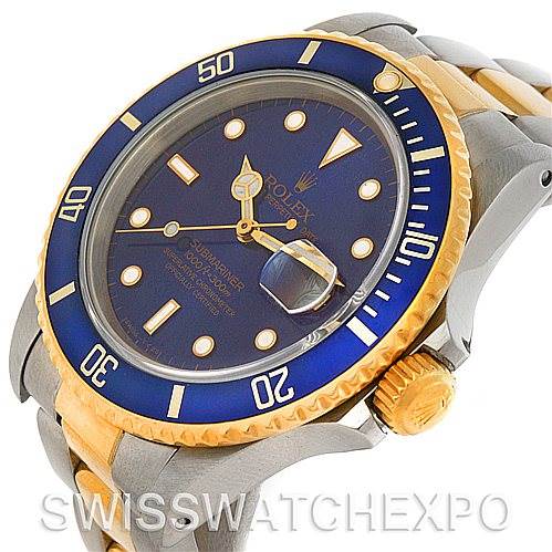 This image shows a side angle of the Rolex Submariner 16803 Men's Steel and Gold (two tone) Blue Dial 16803 Men's Steel and Gold (two tone) Blue Dial, showcasing the watch face, bezel, crown, and part of the metal bracelet.
