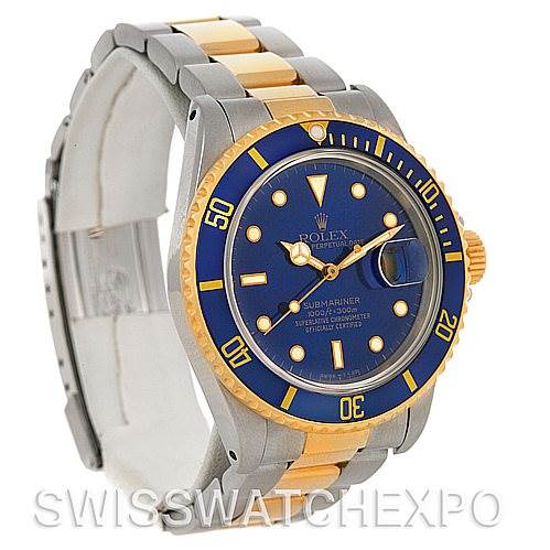 The image shows a Rolex Submariner 16803 Men's Steel and Gold (two tone) Blue Dial 16803 Men's Steel and Gold (two tone) Blue Dial watch at an angle highlighting its blue dial, bezel, and two-tone bracelet.