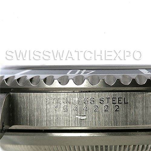 This image shows a close-up side view of the Rolex Submariner 14060M Men's Stainless Steel Black Dial 14060M Men's Stainless Steel Black Dial watch, highlighting the stainless steel bezel and case with the serial number.