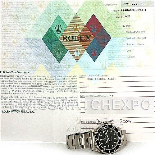 The image shows a Rolex Submariner 14060M Men's Stainless Steel Black Dial 14060M Men's Stainless Steel Black Dial watch laid flat with its warranty card and booklet in the background.
