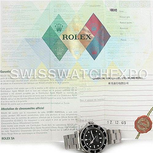 The image shows a Rolex Submariner 16610 Men
s Stainless Steel Black Dial 16610 Men
s Stainless Steel Black Dial watch along with its warranty card and official documentation.