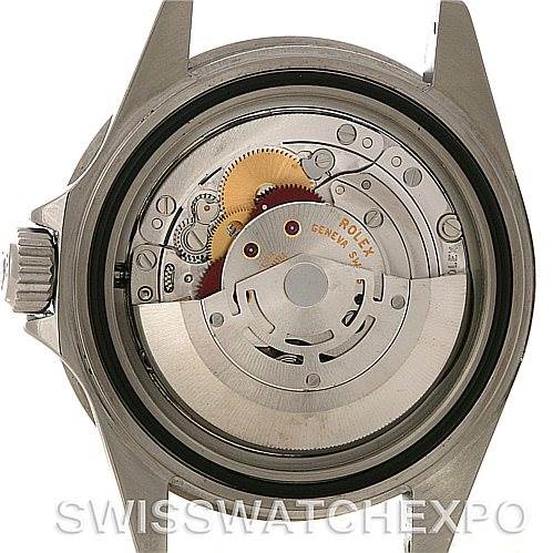 The image shows the open case back revealing the movement of a Rolex Submariner 16610 Men's Stainless Steel Black Dial 16610 Men's Stainless Steel Black Dial watch.