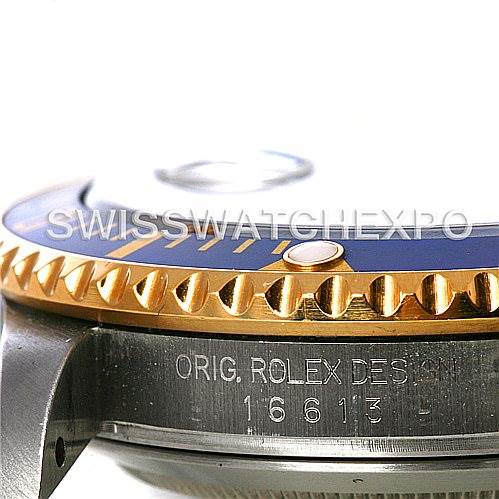 The image shows a close-up side angle of the Rolex Submariner 16613 Men's Steel and Gold (two tone) Grey Dial 16613 Men's Steel and Gold (two tone) Grey Dial watch's bezel and case markings.