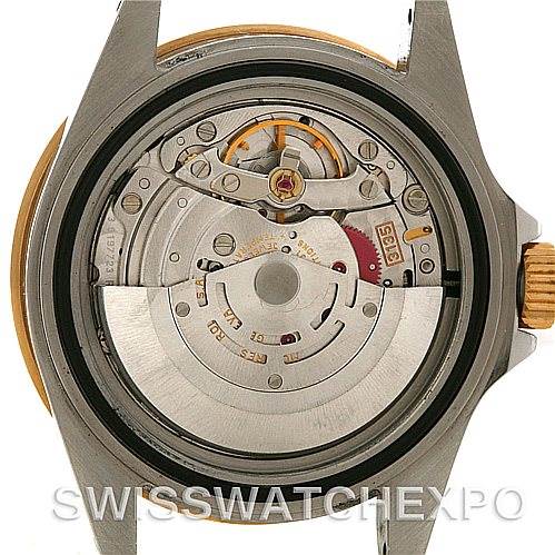 The image shows the movement and inner workings of a Rolex Submariner 16613 Men's Steel and Gold (two tone) Grey Dial 16613 Men's Steel and Gold (two tone) Grey Dial watch from a rear view.