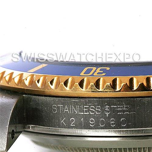 The image shows a close-up side angle of the Rolex Submariner 16613 Men's Steel and Gold (two tone) Grey Dial 16613 Men's Steel and Gold (two tone) Grey Dial watch, highlighting the engraved stainless steel case and bezel.