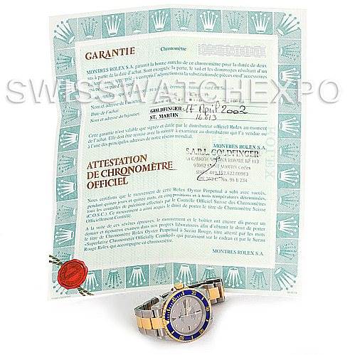 The image shows a Rolex Submariner 16613 Men's Steel and Gold (two tone) Grey Dial 16613 Men's Steel and Gold (two tone) Grey Dial watch placed in front of its warranty certificate and official chronometer certification.