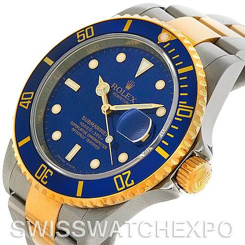 The image shows a Rolex Submariner 16613 Men's Steel and Gold (two tone) Blue Dial 16613 Men's Steel and Gold (two tone) Blue Dial watch angled slightly from the side, highlighting the bezel, dial, crown, and part of the bracelet.