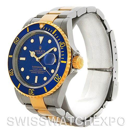 This Rolex Submariner 16613 Men's Steel and Gold (two tone) Blue Dial 16613 Men's Steel and Gold (two tone) Blue Dial watch is shown at an angle that highlights the face, bezel, and bracelet in a mix of gold and stainless steel.