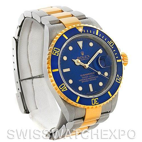 This image shows a side angle of the Rolex Submariner 16613 Men's Steel and Gold (two tone) Blue Dial 16613 Men's Steel and Gold (two tone) Blue Dial watch, displaying its blue dial, two-tone bracelet, and bezel.