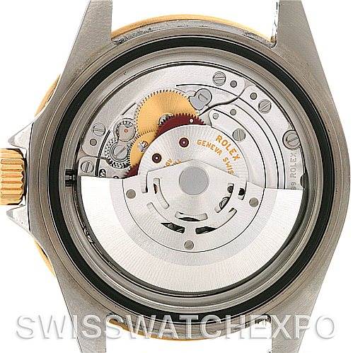 This image shows the back view of the Rolex Submariner 16613 Men's Steel and Gold (two tone) Blue Dial 16613 Men's Steel and Gold (two tone) Blue Dial watch, revealing its internal mechanical movement.