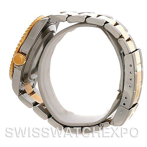 Side view of a Rolex Submariner 16613 Men's Steel and Gold (two tone) Blue Dial 16613 Men's Steel and Gold (two tone) Blue Dial, showcasing its bracelet, crown, and case.