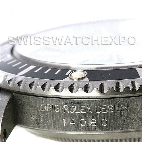 This image shows a close-up angle of the bezel and side engraving of a Rolex Submariner 14060M Men's Stainless Steel Black Dial 14060M Men's Stainless Steel Black Dial, model 14060.
