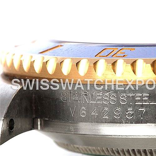 The image shows a close-up side view of a Rolex Submariner 116613BLSO Men's Steel and Gold (two tone) Blue Dial 116613BLSO Men's Steel and Gold (two tone) Blue Dial's bezel and part of its stainless steel case.