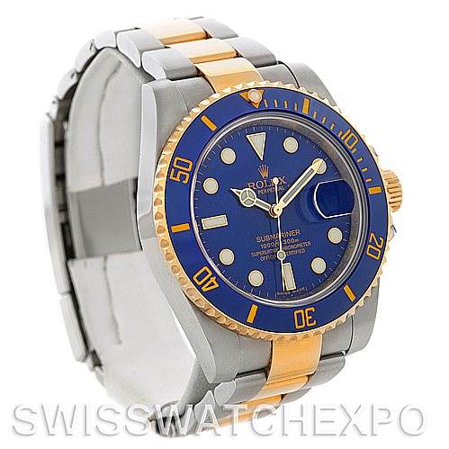 The image shows a Rolex Submariner 116613BLSO Men's Steel and Gold (two tone) Blue Dial 116613BLSO Men's Steel and Gold (two tone) Blue Dial watch at a three-quarter angle, highlighting the blue dial, gold bezel, and two-tone bracelet.