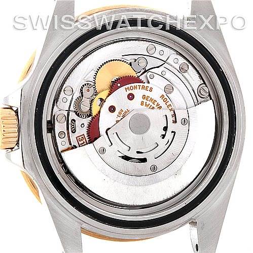 This image shows the back view of a Rolex Submariner 16613 Men's Steel and Gold (two tone) Blue Dial 16613 Men's Steel and Gold (two tone) Blue Dial watch, displaying its intricate movement mechanism.