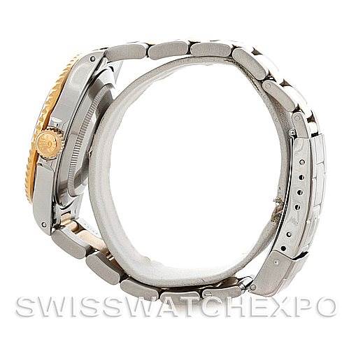 This image shows a side view of a Rolex Submariner 16613 Men's Steel and Gold (two tone) Blue Dial 16613 Men's Steel and Gold (two tone) Blue Dial, highlighting its case, crown, and bracelet.