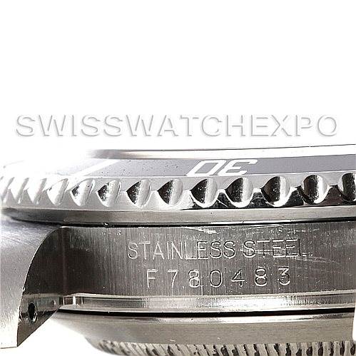 The image shows a close-up side view of the stainless steel case of the Rolex Submariner 16610 Men's Stainless Steel Black Dial 16610 Men's Stainless Steel Black Dial, highlighting the serial number.
